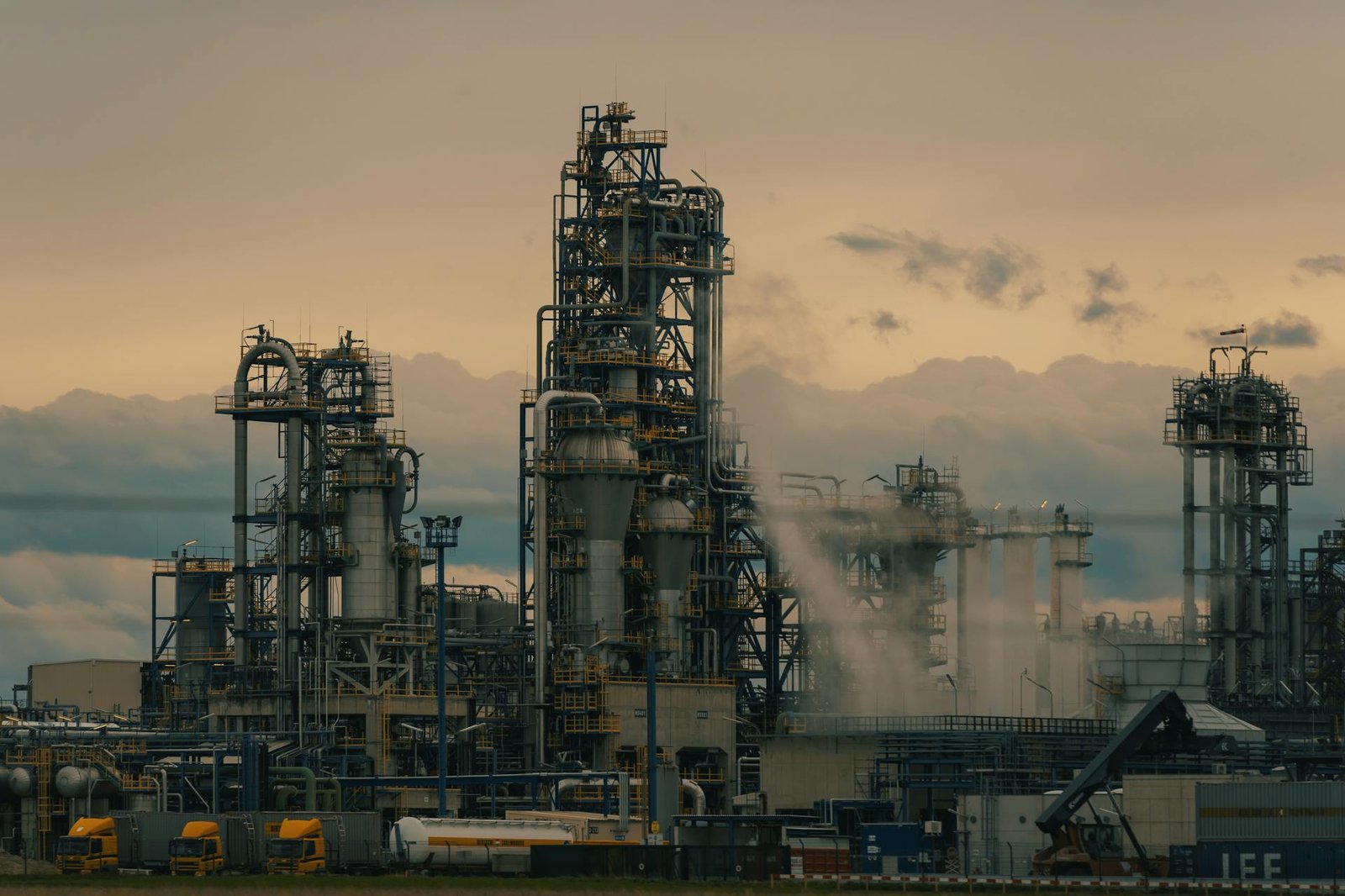 Weson refinery operations at dusk with road tankers loading fuel