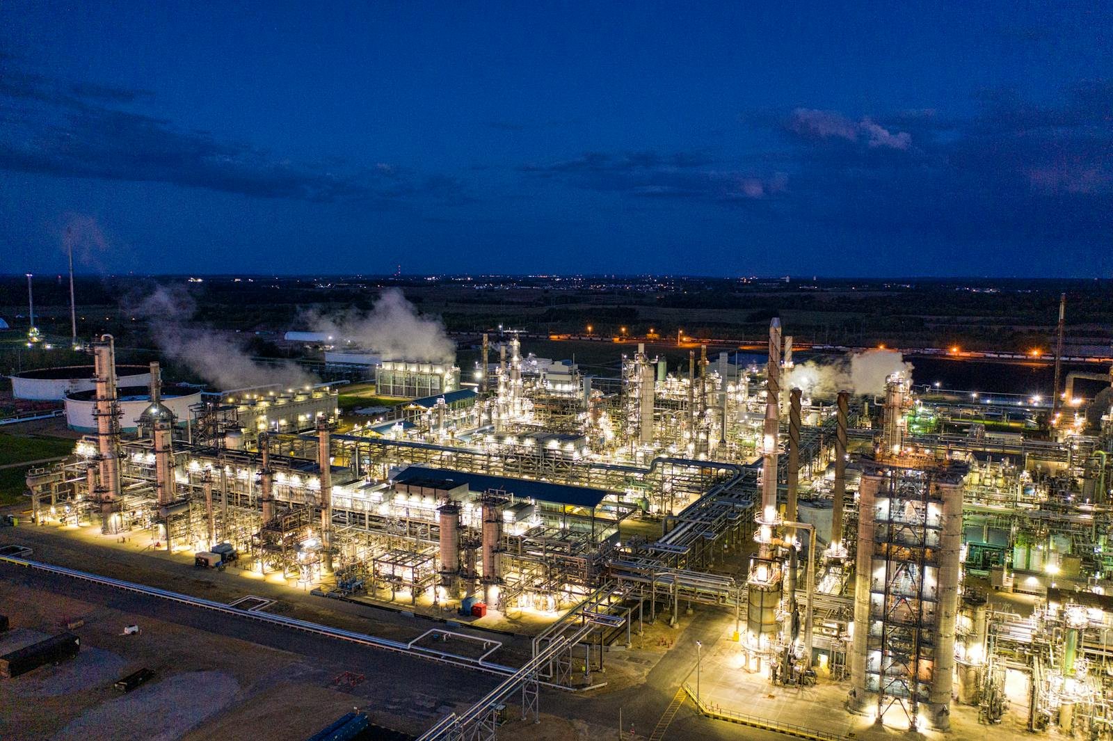 Illuminated petroleum refinery and storage terminal at night